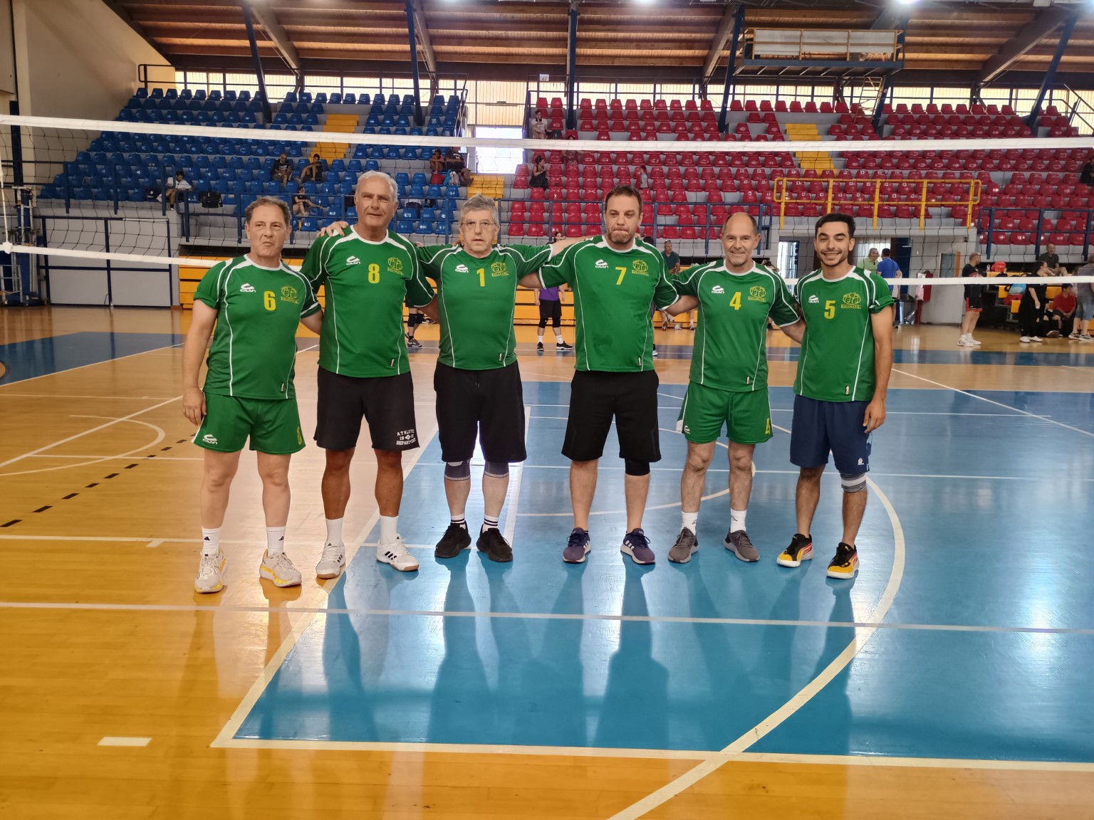 A participating team standing together in front of the net